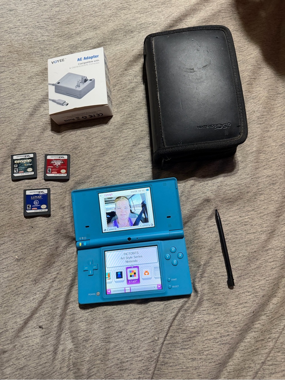 Nintendo Turquoise Blue DSi with Games, Stylus, Case and charger.